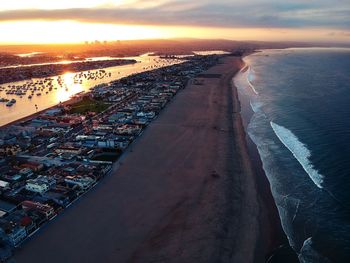 High angle view of beach against sky during sunset