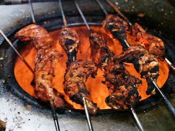 Close-up of meat on barbecue grill
