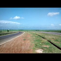 Road passing through field