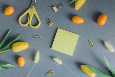 High angle view of yellow chili peppers on paper