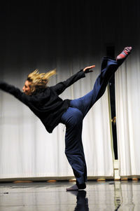 Side view of senior man skateboarding