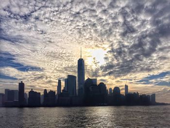 City skyline against cloudy sky