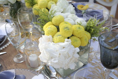 High angle view of white roses on table