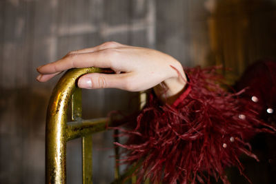 Cropped hand of woman holding steering wheel