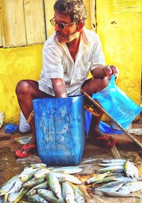 Man selling fish at market