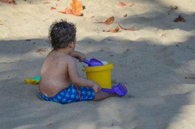 Boy playing on beach