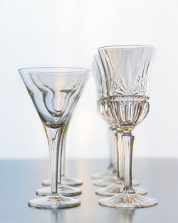 Close-up of wine glasses on table