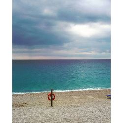 Scenic view of sea against cloudy sky