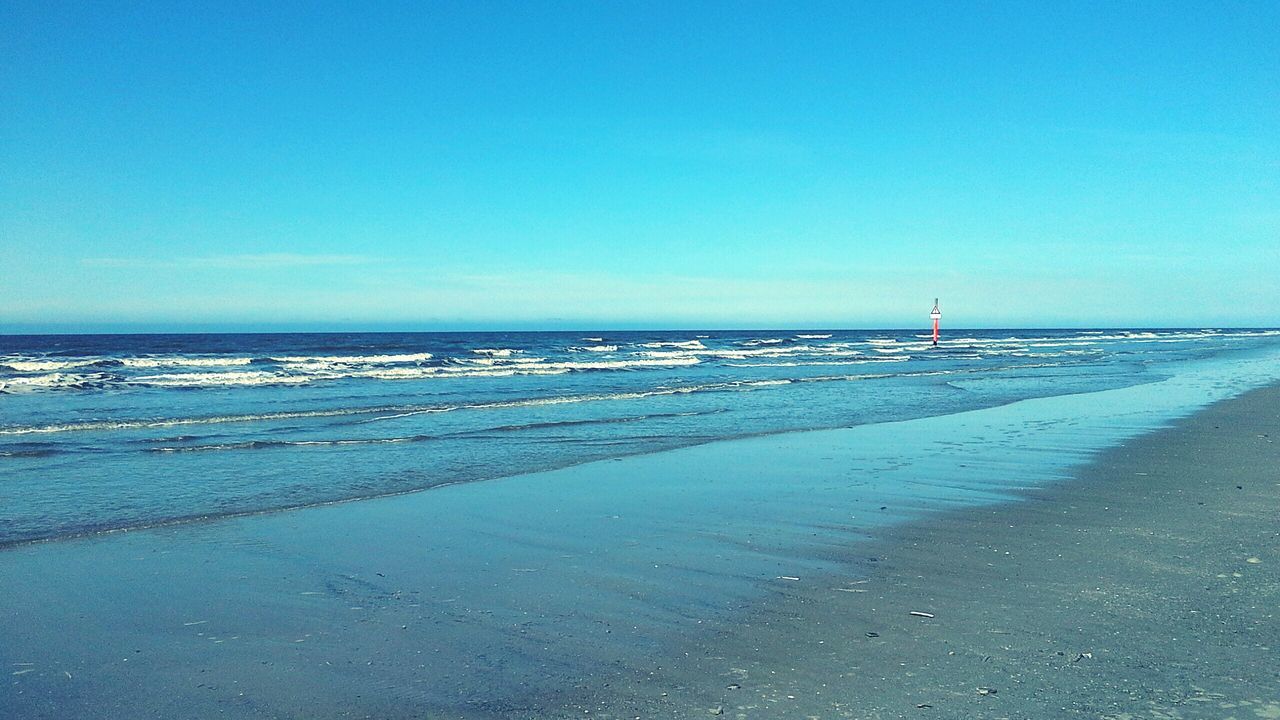 sea, beach, water, clear sky, copy space, horizon over water, sand, blue, shore, tranquil scene, tranquility, scenics, nature, beauty in nature, bird, coastline, transportation, incidental people, animal themes, day