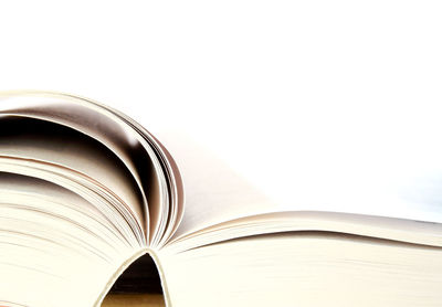 Close-up of open book against white background