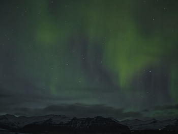 Low angle view of mountain against sky at night