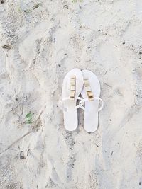 High angle view of shoes on sand