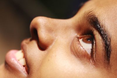 Close-up of woman looking up