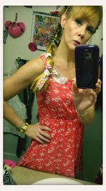 Close-up of hand holding red balloon