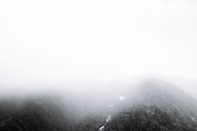 Scenic view of mountains in foggy weather