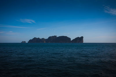 Scenic view of sea against blue sky