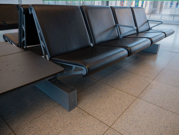 Empty chairs and tables at airport