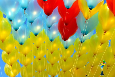 Low angle view of balloons hanging outdoors