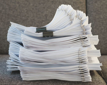 Close-up of paper stack on table