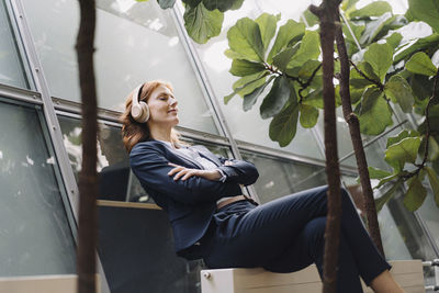 Businesswoman having a break in a modern office building