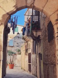 Narrow alley amidst buildings in town