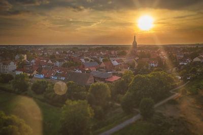 High angle view of cityscape against sky during sunset