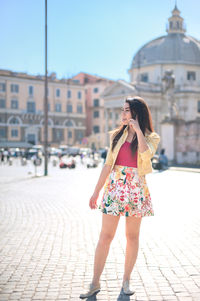 Woman standing in front of building