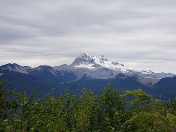 Scenic view of snowcapped mountains against sky