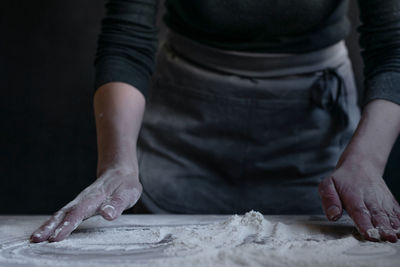 Midsection of man preparing food