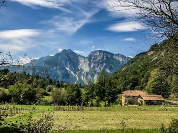 Scenic view of landscape and mountains against sky