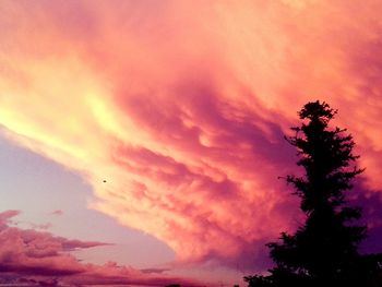 Low angle view of cloudy sky at sunset