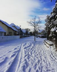 Houses in winter against sky