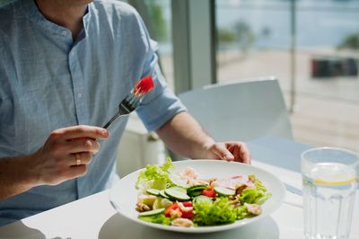 Midsection of man preparing food