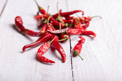 Close-up of red chili peppers on table