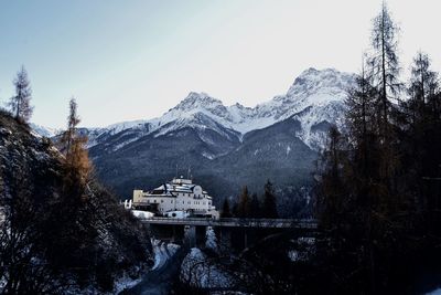 Scenic view of mountains against clear sky during winter