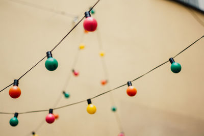 Low angle view of string lights hanging outdoors