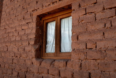 Low angle view of window on old building