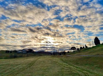 Scenic view of field against sky during sunset