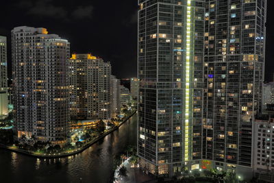 Aerial view of city lit up at night