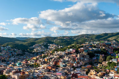 High angle view of buildings in city against sky