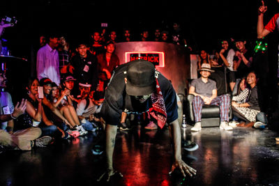Men in traditional temple at night