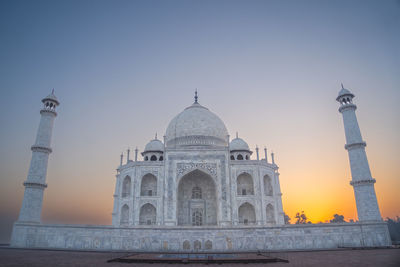 Taj mahal landscape in the fog at sunrise. eighth wonder of the world taj mahal from agra 