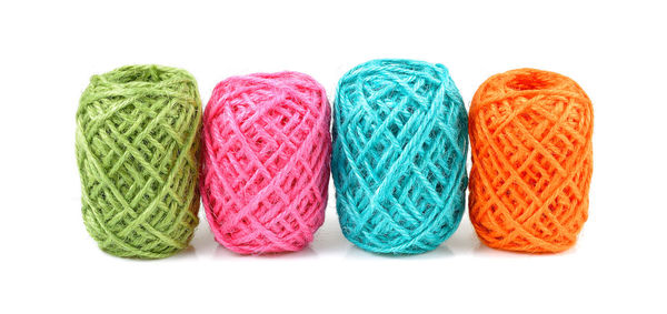 Close-up of multi colored candies against white background