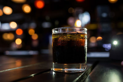 Close-up of beer glass on table