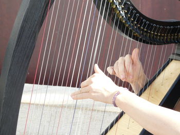 High angle view of woman playing piano