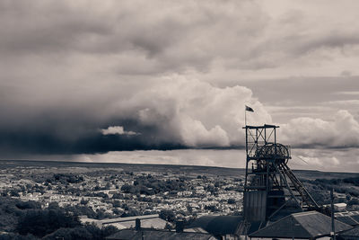 A black and white industrial landscape shot on a cloudy day