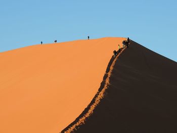 Scenic view of desert against clear sky