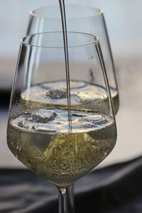 Close-up of wine in glass on table