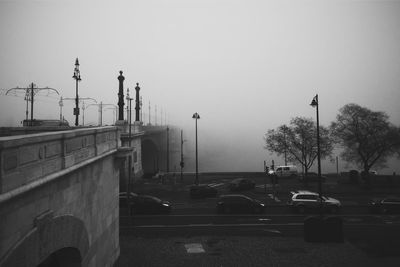 Cars on road against clear sky