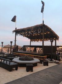 Traditional windmill on restaurant against sky